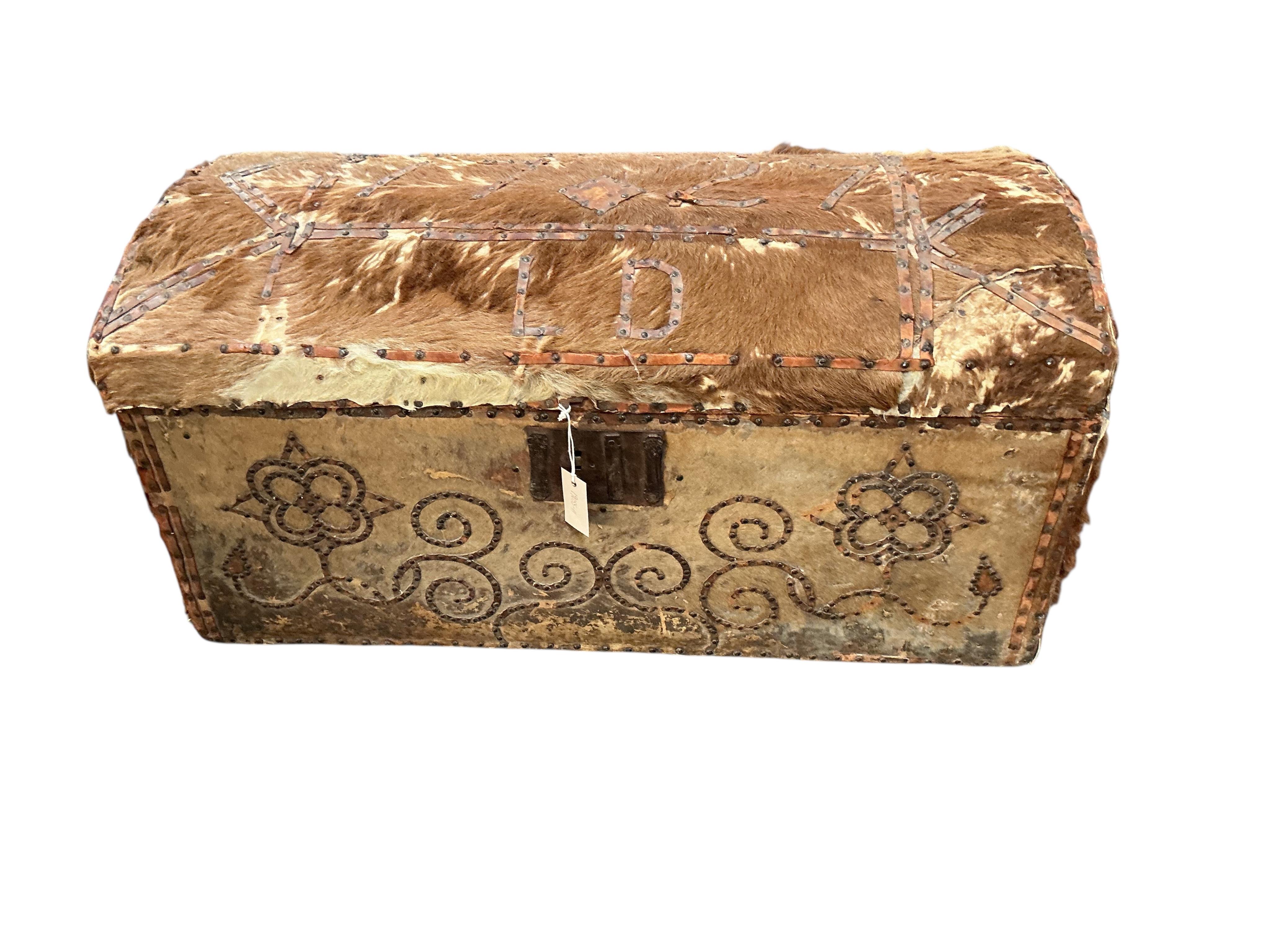 An 18th century domed pony skin trunk with stud work decoration, width 95cm, depth 50cm, height 47cm